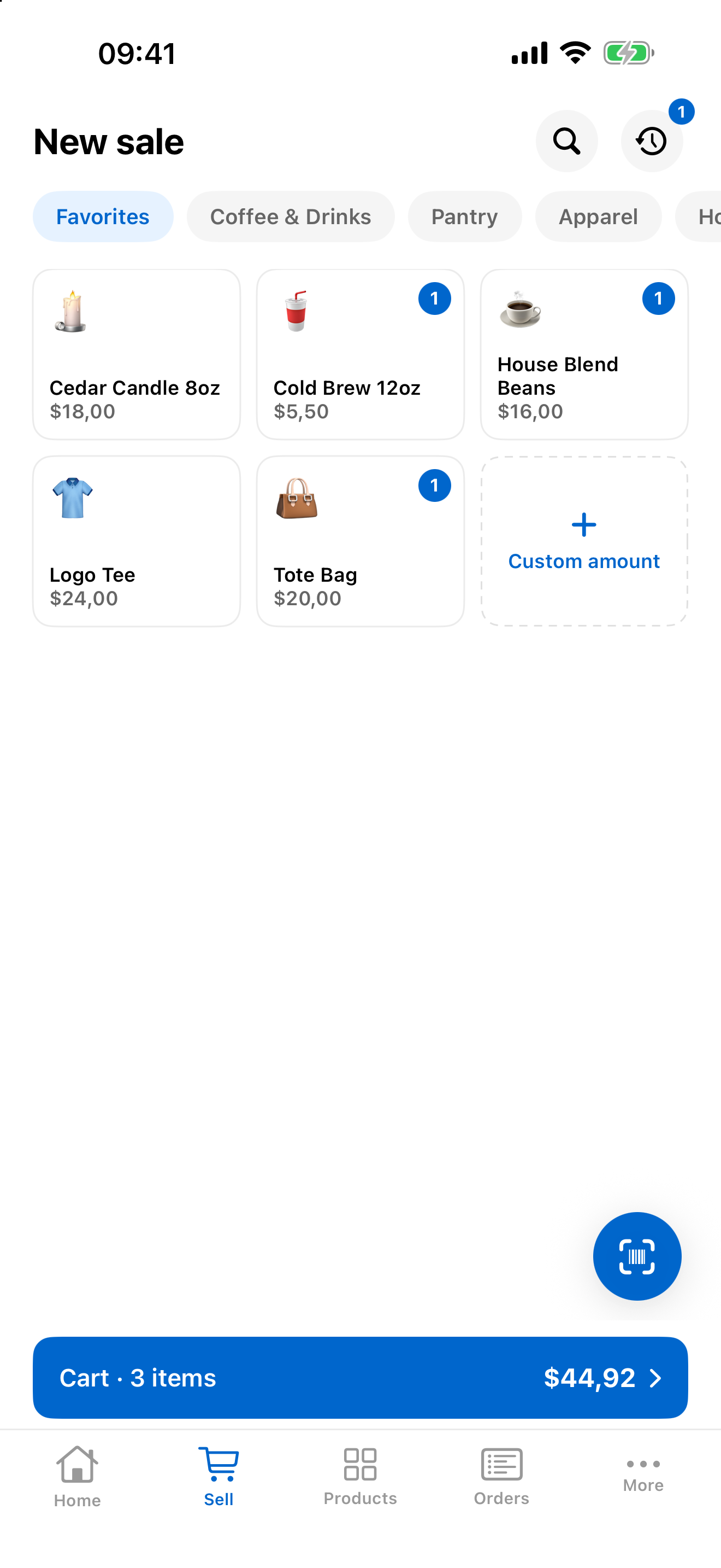 The register with favorites, categories, a scanner button, and a live cart